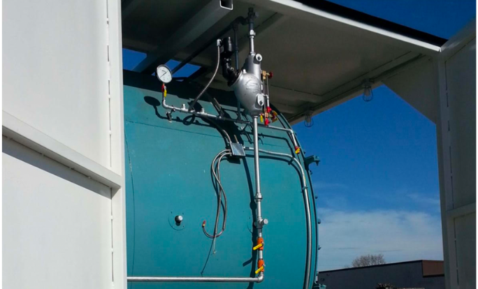 Picture of blue steam boiler. 